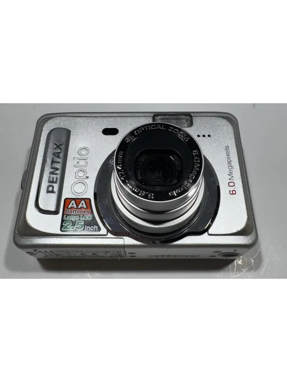 Pentax Optio S60 6.0MP Digital Camera Silver 3x Optical Zoom AA Batteries